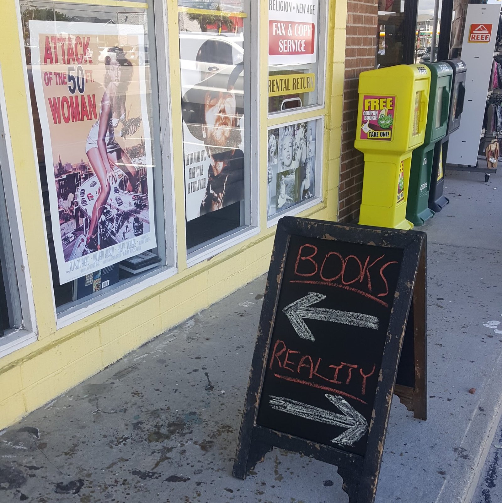 Sidewalk sign: BOOKS → REALLY?